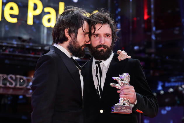 (200301) -- BERLIN, March 1, 2020 -- Directors and screenwriters Damiano D Innocenzo (L) and Fabio D Innocenzo pose for photos on the red carpet after receiving the Silver Bear for Best Screenplay for the film Favolacce during 70th Berlin International Film Festival in Berlin, capital of Germany, Feb. 29, 2020. ) GERMANY-BERLIN-BERLINALE 2020-AWARDS CEREMONY ShanxYuqi 