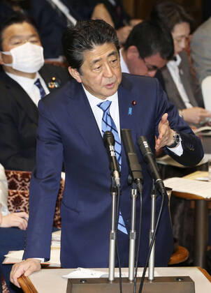 Japan PM Abe Japanese Prime Minister Shinzo Abe attends a House of Councillors Budget Committee session in Tokyo on March 3, 2020.