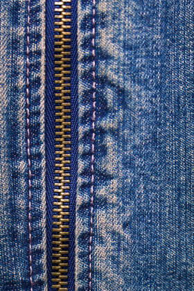 metal zipper with denim metal zipper with denim. close up. macro  Copyright: xpzRomashkax 13330286