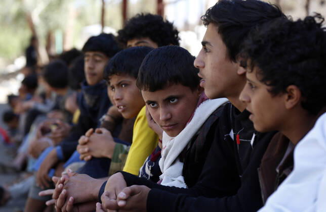(200323) -- SANAA, March 23, 2020 -- Orphan children wait to receive masks and disinfectants against the coronavirus in an orphan center in Sanaa, Yemen, March 23, 2020. A local charity organization in Sanaa distributed on Monday health kits of masks and disinfectants to Yemeni orphan students as an aid to protect them against the coronavirus. (Photo by Mohammed Mohammed Xinhua) YEMEN-SANAA-CORONAVIRUS-HEALTH KIT-DISTRIBUTION NiexYunpeng 