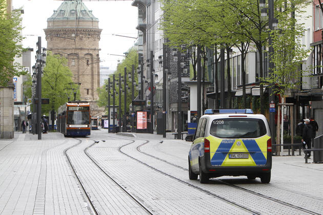 On the occasion of the Corona crisis, a police patrol of the Baden Württemberg state police checks the observance of the contact prohibitions and minimum distances on the Planken shopping street and pedestrian zone in the city centre of Stuttgart, Baden Württemberg, Bavaria, Germany
