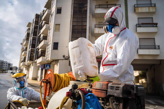April 14, 2020, Ericeira, Portugal: An employee of the Ericeira parish council, equipped with the recommended protective materials, prepares the solution based on hypochlorite (bleach), for disinfecting the street..The municipality of Mafra had 70 cases of COVID-19 pandemic. In order to prevent the spread of the virus, the Ericeira Parish Council perform weekly street disinfection. Ericeira Portugal - ZUMAs197 20200414_zaa_s197_176 Copyright: xHenriquexCasinhasx