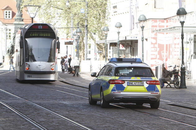 A police patrol of the Baden Württemberg state police checks the compliance with the contact prohibitions and minimum distances on the shopping street and pedestrian zone Kaiser Joseph Straße in the city centre of Freiburg im Breisgau, Baden Württemberg, Bavaria, Germany