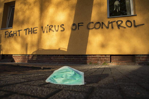 A graffiti with the writing Fight the virus of control in Berlin on April 17, 20