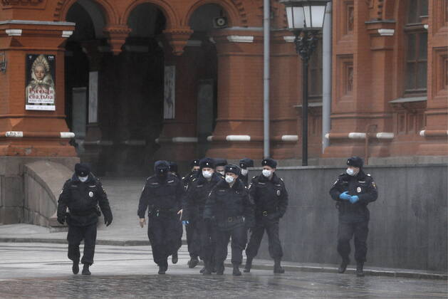 MOSCOW, RUSSIA - APRIL 18, 2020: Police officers seen in Tverskaya Street during the ongoing COVID-19 coronavirus pandemic. Russian President Vladimir Putin expanded non-working period till April 30, 2020 to prevent the spread of the COVID-19 coronavirus infection. Alexander Shcherbak TASS  TS0D62F6