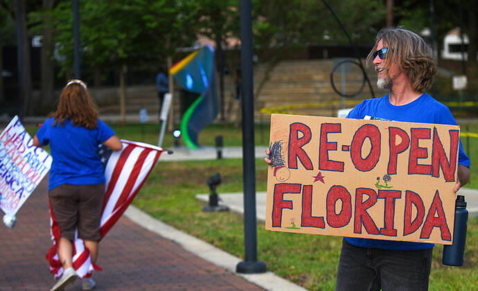 April 17, 2020, Orlando, Florida, United States: Protesters demonstrate outside the Orange County Administration Building demanding the end of stay-at-home orders and the reopening of Florida businesses as the COVID-19 pandemic keeps thousands of people in their homes and out of work. Orlando United States - ZUMAs197 20200417_zaa_s197_227 Copyright: xPaulxHennessyx