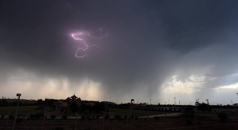 NEW DELHI, INDIA - APRIL 18: Heavy rain and lightening seen over Akshardham Temple during lockdown, on April 18, 2020 in New Delhi, India. (Photo by Raj K Raj Hindustan Times ) Heavy Rainfall In Delhi-NCR