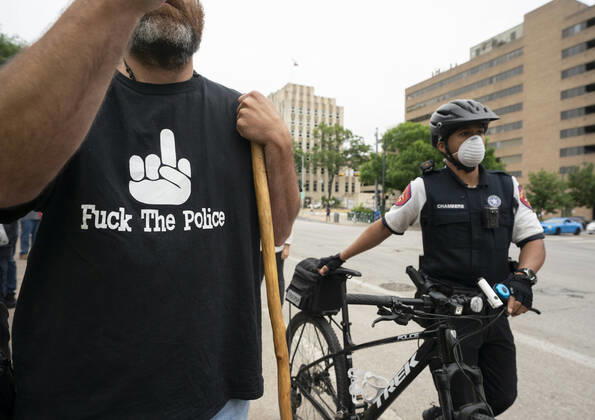 April 18, 2020, Austin, Texas, USA: Dept. of Public Safety troopers arrive as a few hundred Texans flaunt social distancing guidelines in an InfoWars inspired rally at the Texas Capitol where founder Alex Jones encourages the crowd with right-wing rhetoric. Gov. Greg Abbott announced Friday relaxed restrictions on business starting next week. Austin USA - ZUMAd150 20200418_znp_d150_022 Copyright: xBobxDaemmrichx