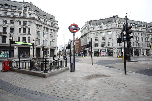 Day Twenty Six of Lockdown in London. Oxford Circus, at the crossing of Oxford Street and Regent Street is deserted at 10.40am on a very quiet central London for a Saturday as the country is on lockdown due to the COVID-19 Coronavirus pandemic. People are not allowed to leave home except for minimal food shopping, medical treatment, exercise - once a day, and essential work. COVID-19 Coronavirus lockdown, London, UK, on April 18, 2020 