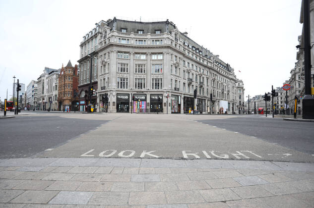 Day Twenty Six of Lockdown in London. Oxford Circus, at the crossing of Oxford Street and Regent Street is deserted at 10.40am on a very quiet central London for a Saturday as the country is on lockdown due to the COVID-19 Coronavirus pandemic. People are not allowed to leave home except for minimal food shopping, medical treatment, exercise - once a day, and essential work. COVID-19 Coronavirus lockdown, London, UK, on April 18, 2020 