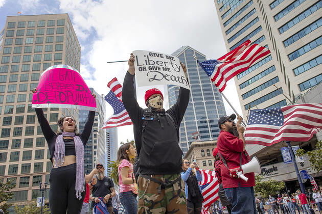 April 18, 2020, San Diego, CA, USA: Protesters in favor of reopening businesses in California came to Broadway in downtown San Diego midday to raise their voices. San Diego USA - ZUMAga3_ 20200418_zap_ga3_001 Copyright: xJohnxGastaldox