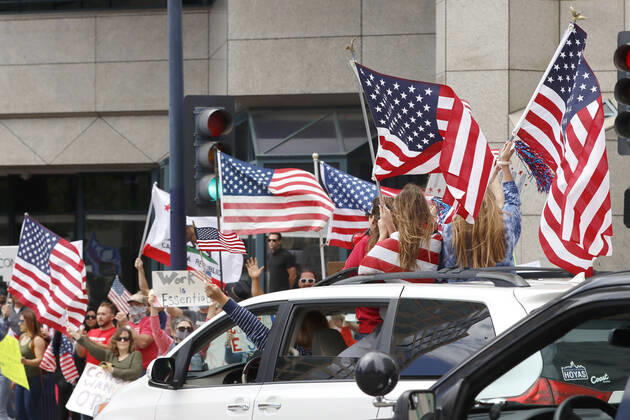 April 18, 2020, San Diego, CA, USA: Protesters in favor of reopening businesses in California came to Broadway in downtown San Diego midday to raise their voices. San Diego USA - ZUMAga3_ 20200418_zap_ga3_011 Copyright: xJohnxGastaldox