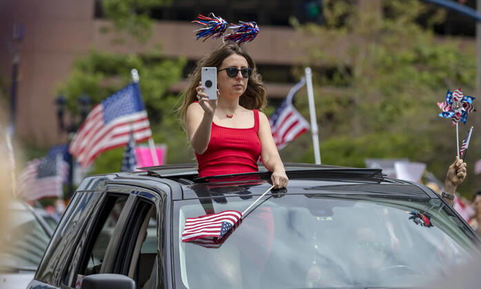 April 18, 2020, San Diego, California, US: Protesters at a Liberate San Diego rally in downtown San Diego on Saturday waved signs and held banners complaining that they wanted the state to lift its stay at home order, a measure meant to reduce the spread of the coronavirus. The event was clearly political, with an overwhelming amount of signs and banners supporting President Trump. San Diego US - ZUMAp23_ 20200418_zaf_p23_015 Copyright: xDavidxPollerx