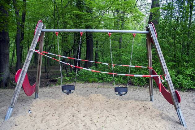 A playground in Cologne Dellbrück NRW Blocked playground due to contact ban because of the corona virus with flutterband
