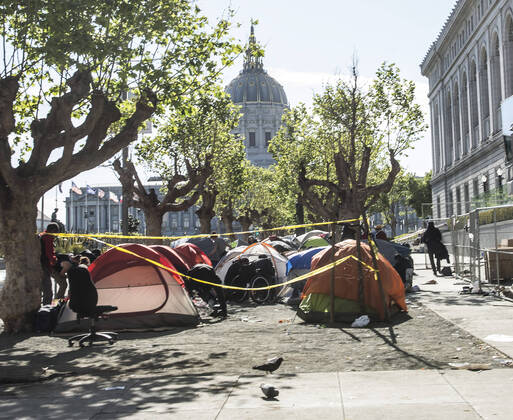 A homeless encampment next to the main library sits in view of City Hall in San Francisco on Sunday, April 19, 2020. San Francisco Mayor London Breed says that efective now, face masks must be worn outside the home to protect against coronavirus.  SXP2020041913 TERRYxSCHMITT