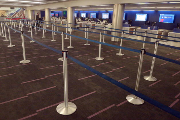 The Delta Air Lines terminal is empty early evening at LAX on Sunday, April 19, 2020 in Los Angeles. Mayor Eric Garcetti said 95% of air travel has stopped in his city as Los Angeles sees the biggest drop of airplane travel in LAX history.  LAP2020041928 JIMxRUYMEN