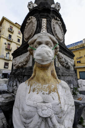 A protective mask is placed on a statue of a sphinx in Piazza Mercato (Marketplace Square), one of the most symbolic and historical places in Naples. Government Decree declaring all of Italy a protected area to combat Covid-19 - Coronavirus infection.  Copyright: xSalvatorexLaportax xIPAx xKontrolabx
