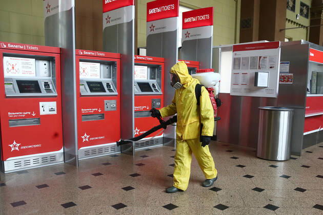 MOSCOW, RUSSIA - APRIL 22, 2020: An Emercom worker in a protective suit carries out disinfection procedures at Kiyevsky railway station amid the ongoing COVID-19 pandemic. Sergei Fadeichev TASS  TS0D6A3B
