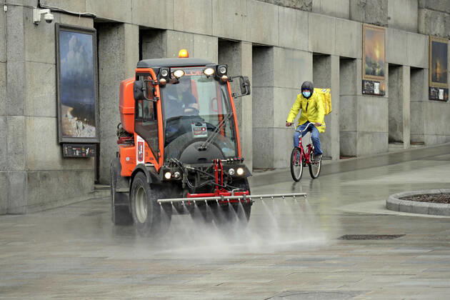 MOSCOW, RUSSIA - APRIL 22, 2020: A street sweeper washes pavements on Tverskaya Street with disinfectant amid the ongoing COVID-19 pandemic; the Russian government has extended a paid period off work until April 30 nationwide to counter the spread of the COVID-19 infection. Mikhail Metzel TASS  TS0D6A4E