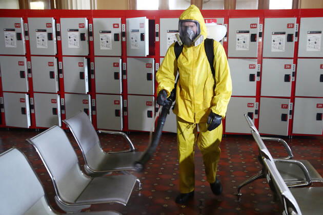 MOSCOW, RUSSIA - APRIL 22, 2020: An Emercom worker in a protective suit carries out disinfection procedures at Kiyevsky railway station amid the ongoing COVID-19 pandemic. Sergei Fadeichev TASS  TS0D6A4A