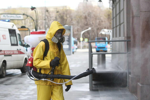 MOSCOW, RUSSIA - APRIL 22, 2020: An Emercom worker in a protective suit carries out disinfection procedures outside Kiyevsky railway station amid the ongoing COVID-19 pandemic. Sergei Fadeichev TASS  TS0D6A6A