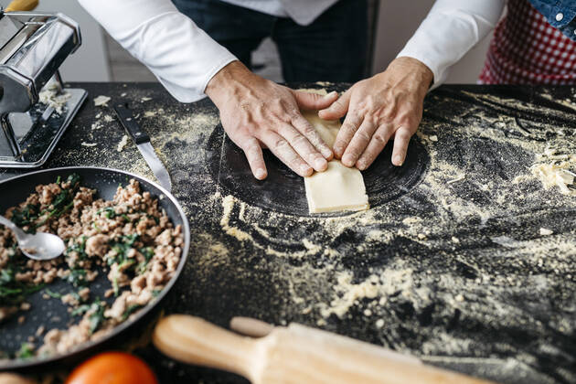 Close-up of man preparing homemade gluten free pasta model released Symbolfoto property released JRFF04311