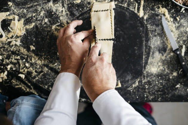 Close-up of man preparing homemade gluten free pasta model released Symbolfoto property released JRFF04314