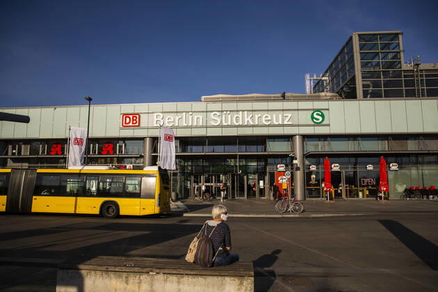 A woman with a face mask waits on the bus in front of the station Suedkreuz in Berlin on April 23, 2020 From yesterday, bookstores and car showrooms can open again under 800 square meters, with hygiene and distance regulations in place Today, there were noticeably more people on the road Coronavirus in Berlin