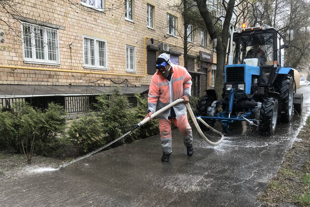 MOSCOW, RUSSIA - APRIL 24, 2020: A utility worker washes with disinfectant pavements on Akademika Zelinskogo Street amid the ongoing COVID-19 pandemic. Mikhail Japaridze TASS  TS0D6EEA