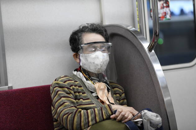 TOKYO, JAPAN - APRIL 24: Commuter wearing face masks with face shield is seen inside of a train amid the coronavirus pandemic on Friday, April 24, 2020 in Tokyo, Japan. Japanese Prime Minister Shinzo Abe declared a nationwide State of Emergency last week to stop the spreading of the coronavirus throughout the country. (Photo: Richard Atrero de Guzman AFLO)  (125672608)
