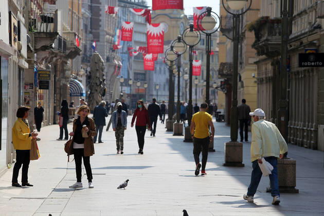 As traders prepare window displays to open, citizens stroll through Korzo 25.04.2020., Croatia, Rijeka - Numerous citizens walked through Korzo. Shops are setting up shop windows ahead of opening next week. GoranxKovacic PIXSELL