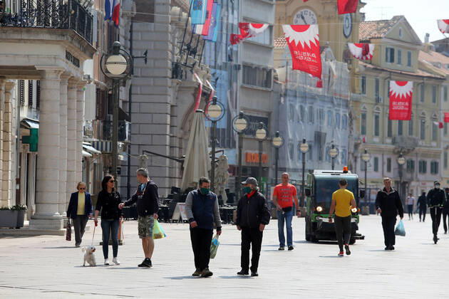 As traders prepare window displays to open, citizens stroll through Korzo 25.04.2020., Croatia, Rijeka - Numerous citizens walked through Korzo. Shops are setting up shop windows ahead of opening next week. GoranxKovacic PIXSELL