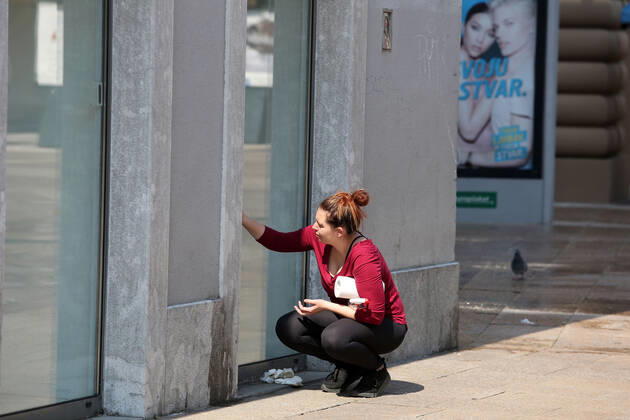 As traders prepare window displays to open, citizens stroll through Korzo 25.04.2020., Croatia, Rijeka - Numerous citizens walked through Korzo. Shops are setting up shop windows ahead of opening next week. GoranxKovacic PIXSELL
