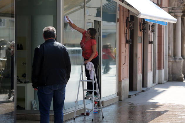 As traders prepare window displays to open, citizens stroll through Korzo 25.04.2020., Croatia, Rijeka - Numerous citizens walked through Korzo. Shops are setting up shop windows ahead of opening next week. GoranxKovacic PIXSELL