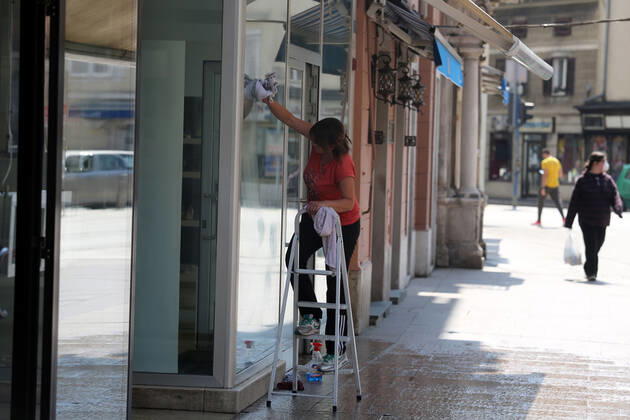 As traders prepare window displays to open, citizens stroll through Korzo 25.04.2020., Croatia, Rijeka - Numerous citizens walked through Korzo. Shops are setting up shop windows ahead of opening next week. GoranxKovacic PIXSELL