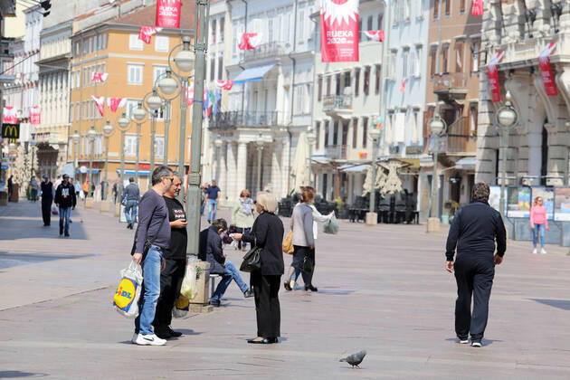 As traders prepare window displays to open, citizens stroll through Korzo 25.04.2020., Croatia, Rijeka - Numerous citizens walked through Korzo. Shops are setting up shop windows ahead of opening next week. GoranxKovacic PIXSELL