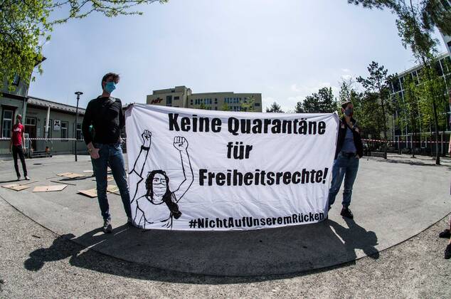 April 25, 2020, Munich, Bavaria, Germany: Contrasting with numerous, controversial Querfront demonstrations in the city center, pro-democracy and left-wing groups demonstrated at the Munich-Giesing train station under the national motto of Ã¢â‚¬oeKeine Quarantaene fuer FreiheitsrechteÃ¢â‚¬Â (No Quarantine for Freedom and Rights). The wave of demonstrations on all fronts are part of a relaxing of the restrictions and in response to a court case that judged the right for demonstrations to be maintained. The group displayed a critical tone against corporations being given favorable treatment during the crisis instead of ordinary people and workers. The group also maintained an explicit pro-science message, with regard to the Coronavirus crisis. Munich Germany - ZUMAb160 20200425_zbp_b160_080 Copyright: xSachellexBabbarx