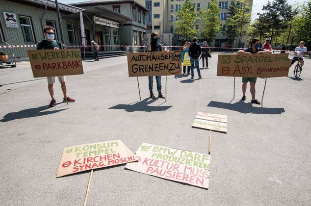 April 25, 2020, Munich, Bavaria, Germany: Contrasting with numerous, controversial Querfront demonstrations in the city center, pro-democracy and left-wing groups demonstrated at the Munich-Giesing train station under the national motto of Ã¢â‚¬oeKeine Quarantaene fuer FreiheitsrechteÃ¢â‚¬Â (No Quarantine for Freedom and Rights). The wave of demonstrations on all fronts are part of a relaxing of the restrictions and in response to a court case that judged the right for demonstrations to be maintained. The group displayed a critical tone against corporations being given favorable treatment during the crisis instead of ordinary people and workers. The group also maintained an explicit pro-science message, with regard to the Coronavirus crisis. Munich Germany - ZUMAb160 20200425_zbp_b160_081 Copyright: xSachellexBabbarx