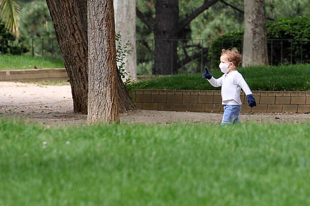 A kid plays in a park of Madrid during the first day of permission so that the children can spend an hour daily on the street during the health crisis due to the Covid-19 virus pandemic - Coronaviruss. April 26,2020. (2020042676)
