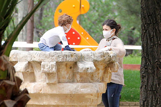 A mother and her son play in a Madrid park during the first day of permission so that the children can spend an hour daily on the street during the health crisis due to the Covid-19 virus pandemic - Coronaviruss. April 26,2020. (2020042679)