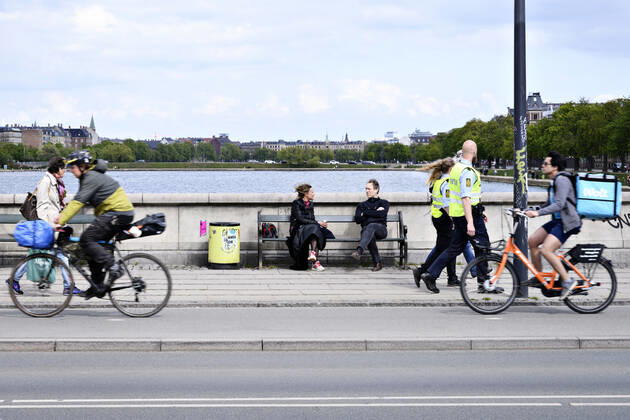 Police patrol while Copenhageners enjoy spring sun on Queen Louises Bridge in Copenhagen on Sunday, April 26, 2020 There is a ban on assembly of over ten people because of the danger of infection with coronavirus covid 19, Copenhagen Denmark,  Copyright: PhilipxDavali PhilipxDavalix COP107 spdk20200426-175211-L