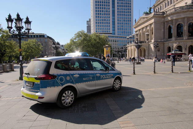 On the occasion of the corona crisis, a police patrol of the Hesse State Police checks the observance of the contact prohibitions and minimum distances on the Opernplatz in downtown Frankfurt, Hesse, Germany