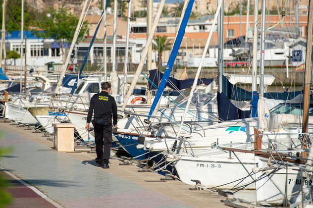 20200426 Children go out of the Home in Mallorca during Corona Lock down PALMA DE MALLORCA, SPAIN APRIL 26 2020 Port Police Offcier controls the moorings at Palma Port at Children go out of the Home in Mallorca during Corona Lock down on April 26, 2020 in Palma de Mallorca, Palma de Mallorca Baleares Spain