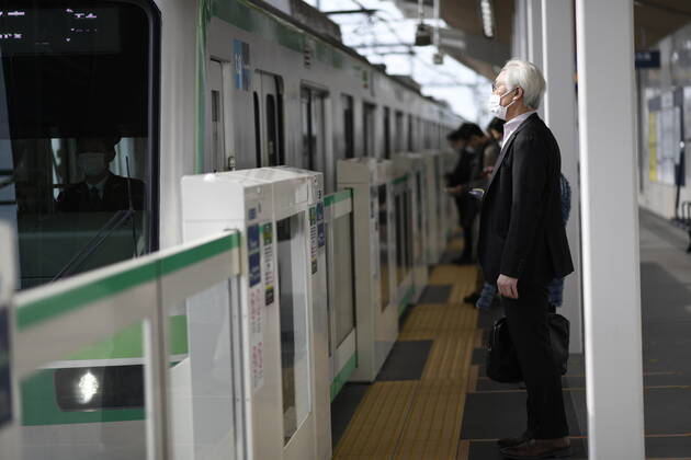 TOKYO, JAPAN - APRIL 27: A man wearing face mask head to work early morning during a rush hour in Tokyo amid concerns of the COVID-19 coronavirus on Monday, April 27, 2020. Japanese Prime Minister Shinzo Abe declared a nationwide State of Emergency last week urging people to stay home to prevent the spreading of the coronavirus throughout the country. (Photo: Richard Atrero de Guzman AFLO)  (125743205)