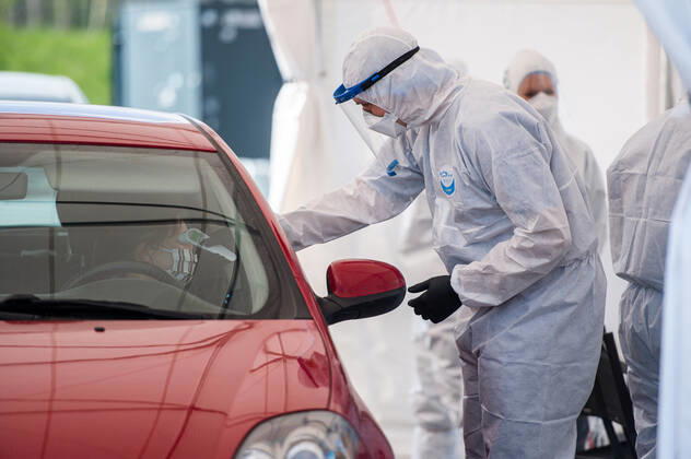 April 27, 2020, Gdansk, Poland: Medic seen measuring a temperature of patient during his work at the covid-19 drive thru in Gdansk. .The covid-19 drive thru testing center was opened in Gdansk on April 27. Tests are taken after prior registration. Patients without getting out of the car may be tested for coronavirus. Gdansk Poland - ZUMAs227 20200427_zip_s227_016 Copyright: xMateuszxSlodkowskix