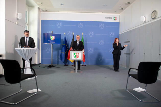Andreas Pinkwart FDP , Minister of Economic Affairs of North Rhine-Westphalia, speaks at a press conference A sign language interpreter also translates The state government reports on the current situation and the measures taken by the state government in the context of the Corona pandemic xx