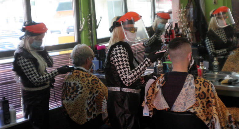 28.04.2020 Belgrade(Serbia) Coronavirus Covid-19 Life loosening measures Friseur hair stylist studio Goca Gotza open after 43 days state of emergency.Friseours Hairdressers Gordana and Sladjana working with new protection masks and vizir visor made of plexiglass.