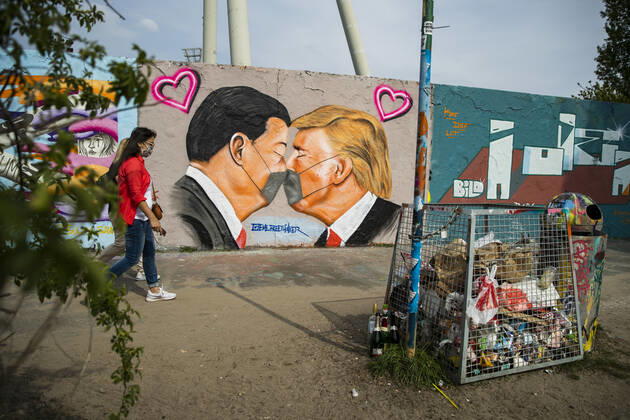 Graffiti by artist Eme Freethinker with USA President Donald Trump and Chinese President Xi Jinping kissing each other with a face mask at Mauerpark in Berlin on April 28, 2020 Since yesterday, it is mandatory to wear nose and mouth protection on trains, trams and busses Starting tomorrow, it will also be mandatory for retailers Coronavirus in Berlin