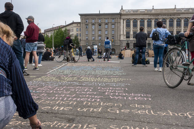 In Leipzig the constitution was painted with chalk on the floor in front of the Leipzig City Library while at a demonstration an open microphone was used for a corona debate for all there was Wilhelm Leuschner Platz Centre Saxony Germany