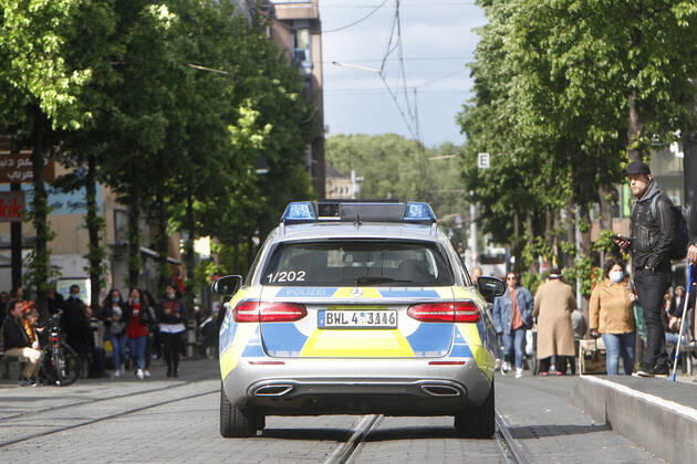On the occasion of the Corona crisis, a police patrol of the state police of Baden Württemberg controls the observance of the contact prohibitions as well as minimum distances on the shopping street and pedestrian zone Planken in the city centre of Mannheim, Baden Württemberg, Germany, which has become highly frequented again after the reopening of the shops.